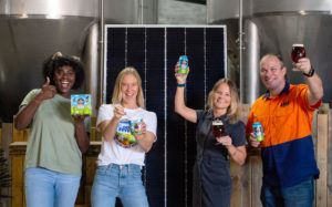 staff at 4 pine brewery in front of solar panel