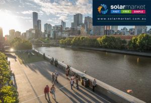 People walking along river in Melbourne