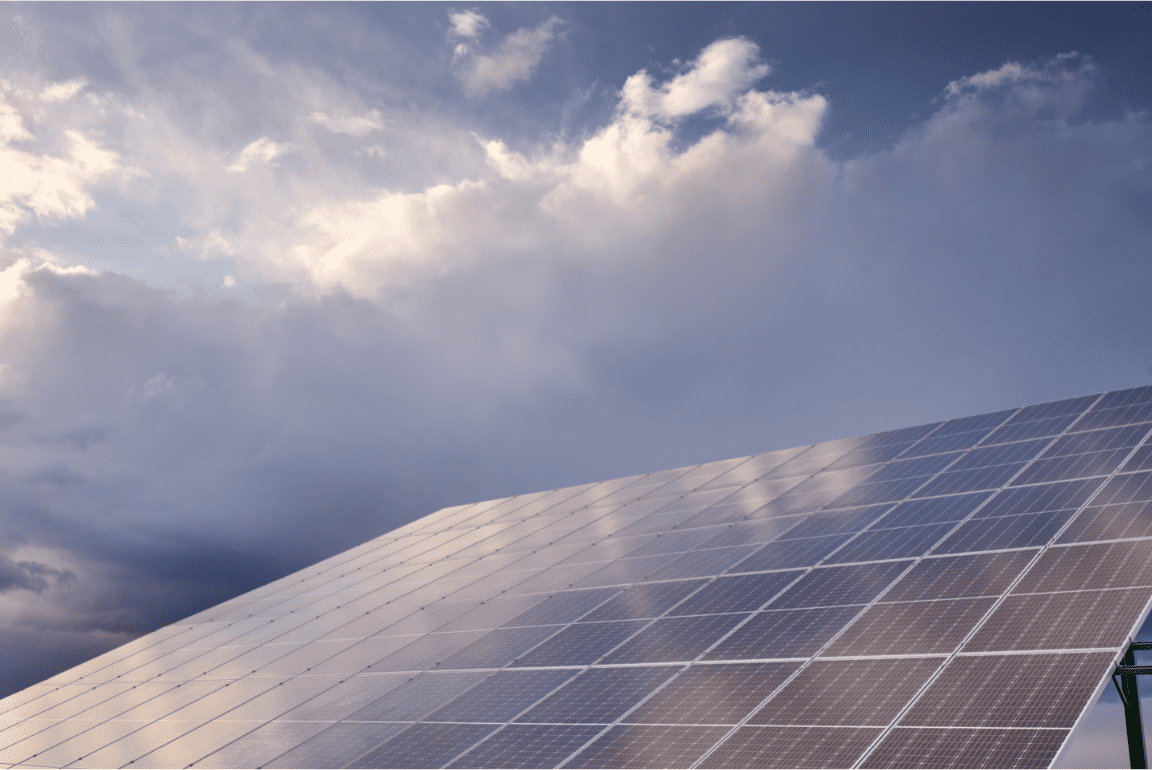 solar panels with cloudy sky