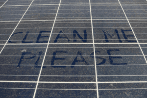 please clean me written on solar panels
