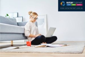 lady sat on floor with laptop