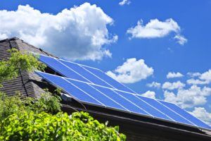 solar panels on roof with blue sky