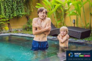 2 boys cold in swimming pool