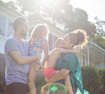 parents holding children in arms