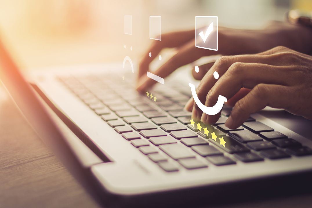 man typing on laptop