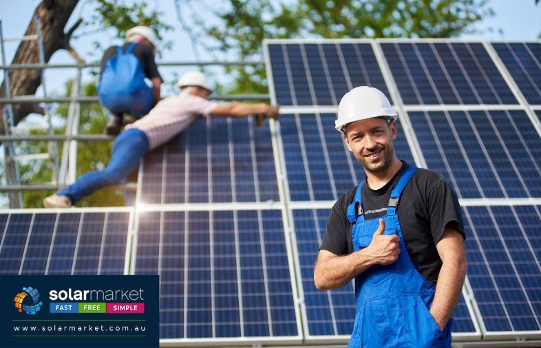 man giving thumbs up in front of solar