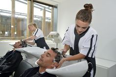 man getting hair washed at hairdressers