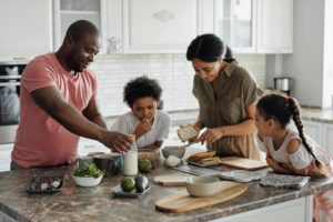 family cooking in kitchen