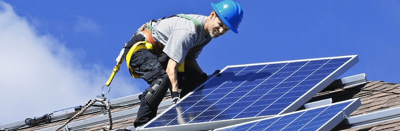 man installing solar