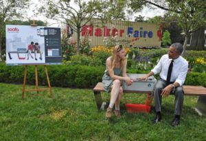 people sitting on solar bench