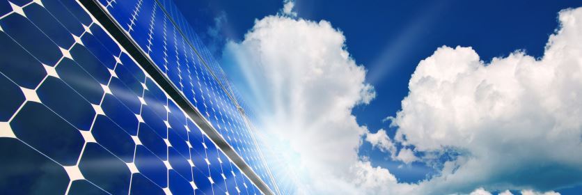solar panels in sky with clouds