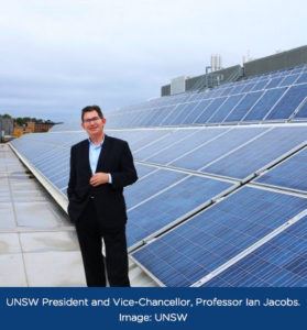 Man in front of solar panels