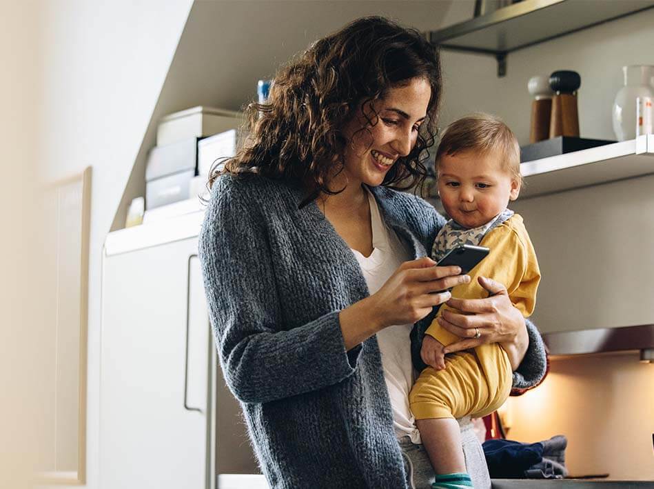 Mother and baby looking at phone