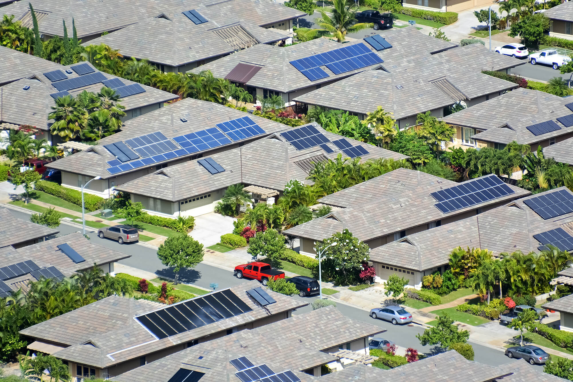 Suburban aerial shot of homes with solar panels